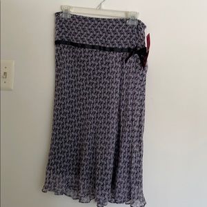 Mid-length purple skirt with fun pattern